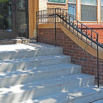 Rebuilt stoop stairs and buttress